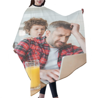 Personality  Selective Focus Of Curly And Noisy Son Touching Tired Freelancer Father Working From Home Hair Cutting Cape