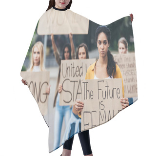 Personality  Serious African American Feminist Holding Placard With Inscription The Future Is Female Near Women On Street Hair Cutting Cape