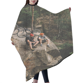 Personality  High Angle View Of Happy Young Trial Bikers Relaxing On Rocky Cliff After Ride Hair Cutting Cape