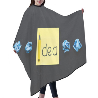 Personality  'idea' Word Written On Sticky Note And Blue Crumpled Paper Balls On Black Background, Ideas Concept Hair Cutting Cape
