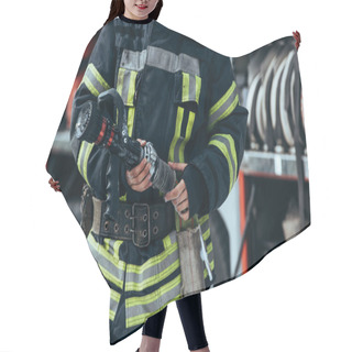 Personality  Cropped Shot Of Firefighter In Protective Uniform Holding Water Hose In Hands Hair Cutting Cape