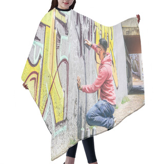 Personality  Street Graffiti Artist Painting With A Color Spray Can A Dark Monster Skull Graffiti On The Wall In The City Outdoor - Urban, Lifestyle Contemporary Street Art Concept - Main Focus On His Hand Hair Cutting Cape