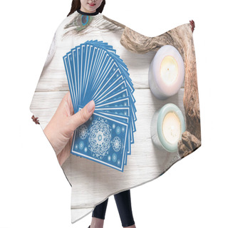Personality  Fortune Teller Woman And A Blue Tarot Cards Over White Wooden Table Background. Hair Cutting Cape