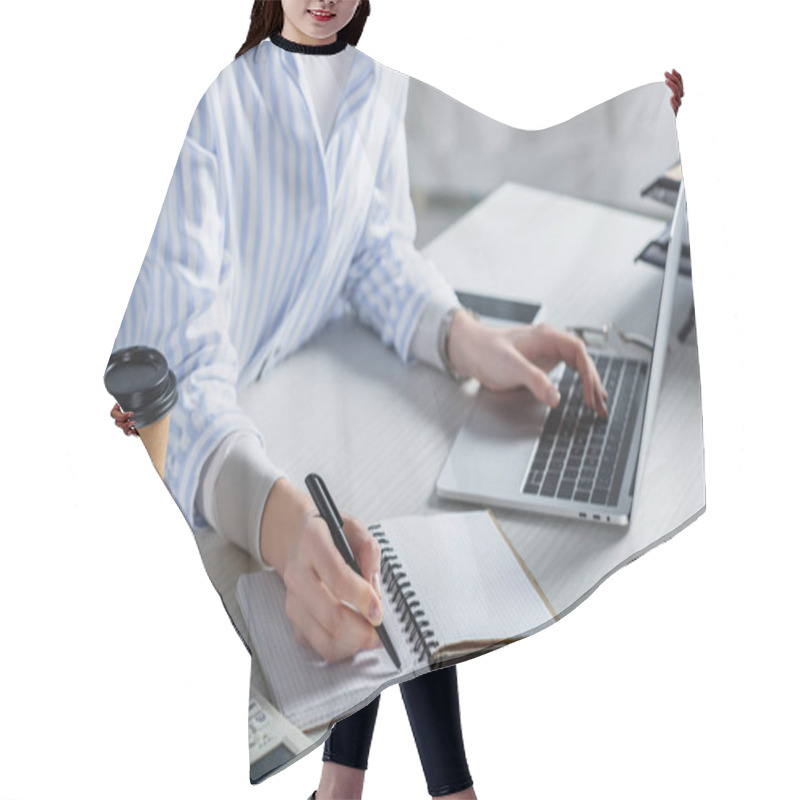 Personality  Cropped view of woman writing in notebook on wooden desk hair cutting cape