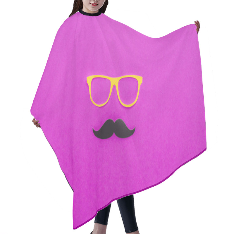 Personality  top view of gentleman face made of cardboard eyeglasses and mustache on pink surface hair cutting cape