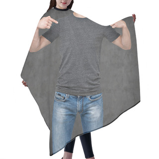 Personality  Close-up Of A Man Pointing His Fingers On A Blank Grey T-shirt. Dark Concrete Background. Hair Cutting Cape
