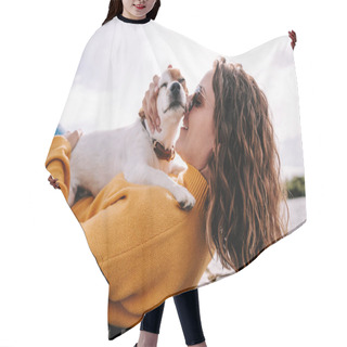 Personality  A Beautiful Woman Lying Down In The Park Hugging Her Cute Little Dog. They Are Enjoying A Sunny Day In Madrid. Family Dog Outdoor Lifestyle Hair Cutting Cape