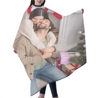 Personality  Cheerful Woman Embracing Husband Sitting On Floor Near Presents And Christmas Tree Hair Cutting Cape