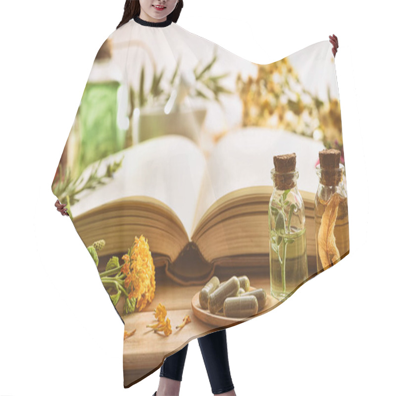Personality  Traditional Medicine With Plants And Book On The Table Hair Cutting Cape