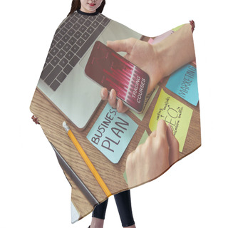 Personality  Cropped Image Of Woman Holding Smartphone With Trading Courses App At Home Hair Cutting Cape