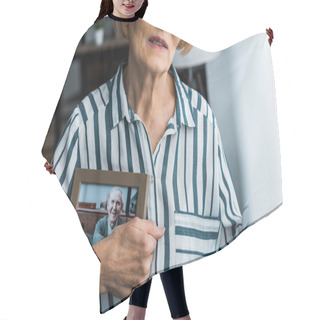 Personality  Partial View Of Senior Woman Holding Frame With Man On Photograph At Home Hair Cutting Cape