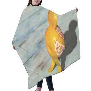 Personality  Concept - Pull Yourself Together And Move On, A Man In The Form Of A Tangerine Carries Himself, Mandarin - Man On A Wooden Blue Background. Hair Cutting Cape
