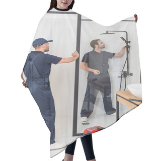 Personality  Worker Standing With Hand On Hip Near Plumber Checking Shower In Bathroom Hair Cutting Cape