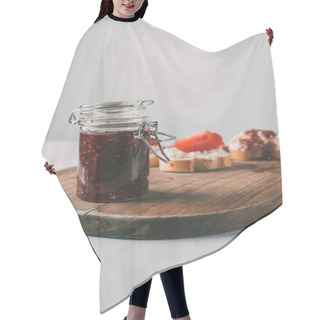 Personality  Selective Focus Of Jar With Fruit Jam On Cutting Board On Grey  Hair Cutting Cape
