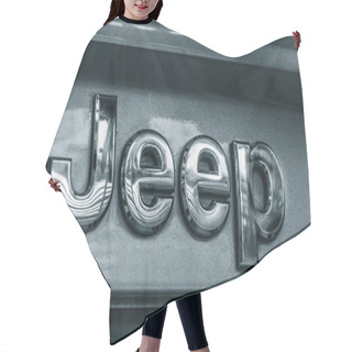 Personality  MONTERREY,  MEXICO - FEBRUARY 20, 2018: Close Up View Of A Metal Jeep Badge Hair Cutting Cape