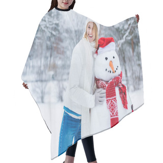 Personality  Portrait Of Cheerful Young Woman Standing Near Snowman And Looking At Camera Hair Cutting Cape