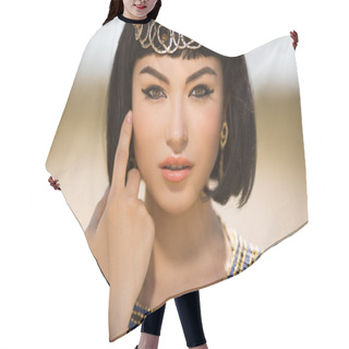 Personality  Beautiful Woman With Fashion Make-up And Hairstyle Like Egyptian Queen Cleopatra Outdoors Against Desert Hair Cutting Cape