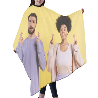 Personality  Worried Bearded Man And Optimistic African American Woman Crossing Fingers Isolated On Yellow Hair Cutting Cape