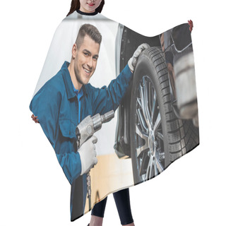 Personality  Cheerful Mechanic Looking At Camera While Holding Pneumatic Wrench Hair Cutting Cape