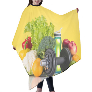 Personality  Close-up View Of Dumbbell, Bottle Of Water And Fresh Fruits And Vegetables On Yellow  Hair Cutting Cape