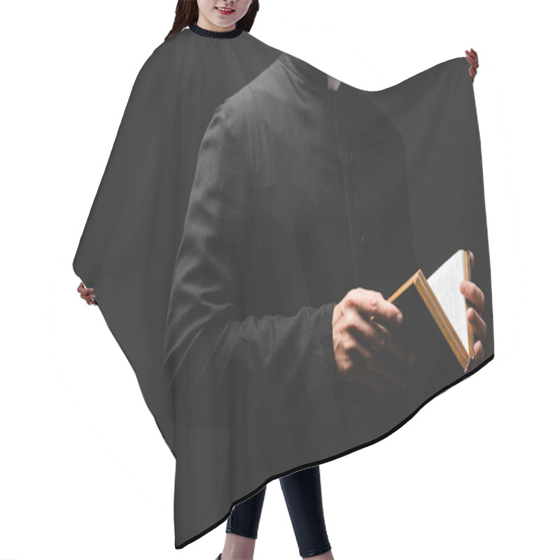Personality  Partial View Of Bearded Priest Holding Holy Bible In Hands Isolated On Black  Hair Cutting Cape