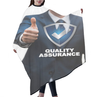 Personality  Selective Focus Of Happy Businessman In Suit Showing Thumb Up Near Quality Assurance Lettering On White  Hair Cutting Cape