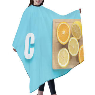 Personality  Top View Of Ripe Cut Lemon And Orange On Wooden Cutting Board Near Letter C On Blue Background Hair Cutting Cape
