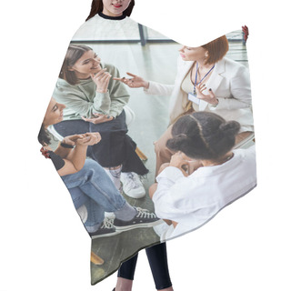 Personality  High Angle View Of Redhead Motivation Coach Pointing At Cheerful Young Woman And Talking Near Multiethnic Girlfriends During Group Therapy, Friendship And Mental Wellness Concept Hair Cutting Cape