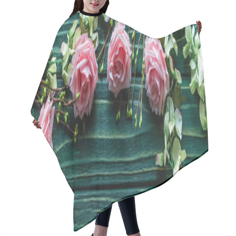 Personality  top view of wooden green background with blossoming branches and roses, panoramic shot hair cutting cape