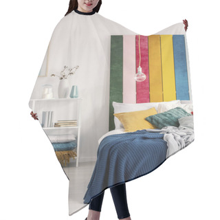 Personality  Vertical View Of Bed With Pillows And Blanket Next To Book Shelf With Books And Vases Hair Cutting Cape