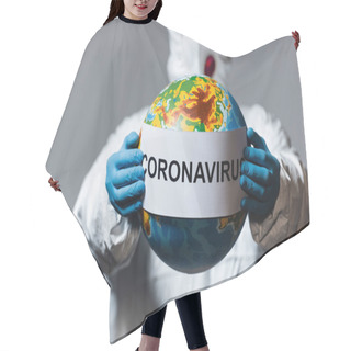 Personality  Selective Focus Of Man In Hazmat Suit And Medical Mask Holding Globe And Paper With Coronavirus Lettering Isolated On Grey  Hair Cutting Cape