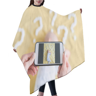 Personality  Cropped Shot Of Mother Taking Top View Photo Of Child Sleeping Surrounded With Question Marks On Yellow Bed Hair Cutting Cape