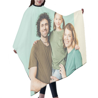 Personality  Happy Parents Carrying Adorable Little Daughter And Smiling At Camera Hair Cutting Cape