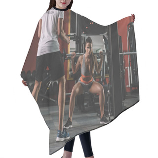 Personality  Cropped View Of Personal Trainer Looking At Young Sportswoman Lifting Barbell Hair Cutting Cape