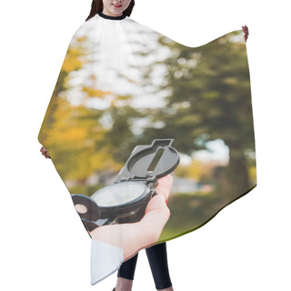 Personality  Cropped View Of Woman Holding Compass In Autumnal Park  Hair Cutting Cape