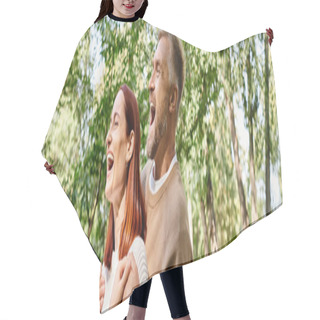 Personality  A Loving Couple In Casual Attire Standing In The Serene Woods. Hair Cutting Cape