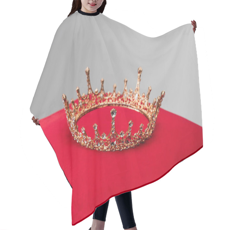 Personality  luxury crown on red velvet cushion isolated on grey hair cutting cape