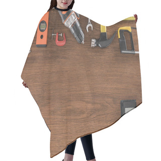 Personality  Top View Of Arranged Various Tools And Calculator On Wooden Table  Hair Cutting Cape