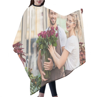 Personality  Smiling Florists Holding Burgundy Roses Near Flower Shop And Looking At Camera Hair Cutting Cape