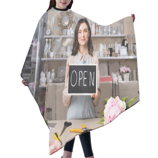 Personality  Smiling Florist Holding Chalkboard With Open Lettering Near Bouquet On Desk With Tools And Decorative Ribbons Hair Cutting Cape