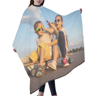 Personality  Street Sports: A Boy And Two Girls In Sunglasses Sit Together On A Large Longboard. The Summer Solchechny Frame. Hair Cutting Cape