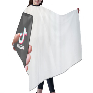 Personality  Paris - France - March 15, 2022 : Hand Holding Iphone Smartphone With TikTok Logo. Horizontal Banner Hair Cutting Cape