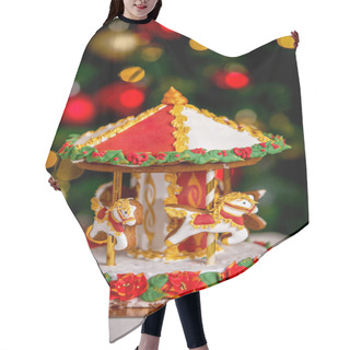 Personality  Gingerbread Carousel In Front Of Defocused Lights Of Chrismtas Decorated Fir Tree. Holiday Sweets. New Year And Christmas Theme. Festive Mood. Hair Cutting Cape