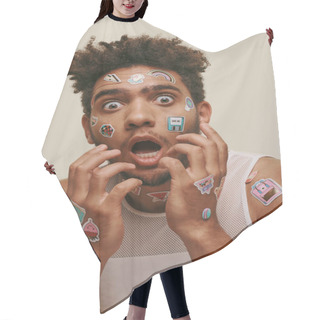 Personality  Shocked African American Guy In Tank Top With Stickers On Face Looking At Camera On Grey Background Hair Cutting Cape