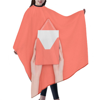 Personality  Partial Top View Of Person Holding Red Envelope With Blank White Card Isolated On Red Hair Cutting Cape