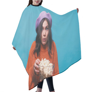 Personality  Thrilled Woman Holding Bowl With Popcorn While Watching Film Isolated On Blue Hair Cutting Cape
