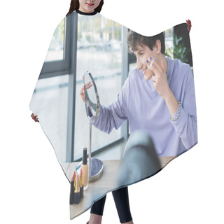 Personality  Side View Of Smiling Transgender Person Applying Face Powder Ear Mirror And Blurred Digital Camera  Hair Cutting Cape