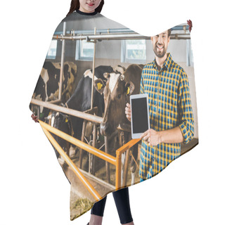 Personality  Handsome Smiling Farmer Showing Tablet With Blank Screen In Stable With Cows Hair Cutting Cape