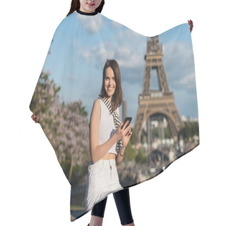 Personality  Happy Young Woman In Stylish Outfit Using Smartphone While Sitting Near Eiffel Tower In Paris  Hair Cutting Cape