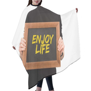 Personality  Cropped Image Of Woman Holding Wooden Board With Inscription Enjoy Life Isolated On White Hair Cutting Cape